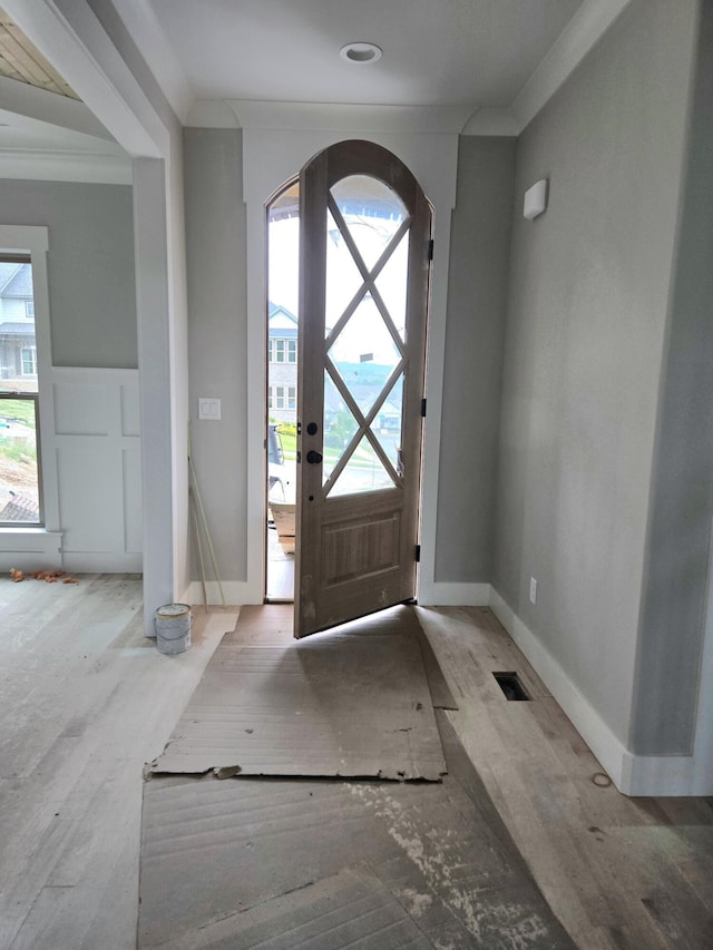 9892 Trestle Cir Unit 50, Ooltewah, TN 37363 - foyer featuring ornamental molding, healthy amount of natural light, wood finished floors, arched walkways, and baseboards