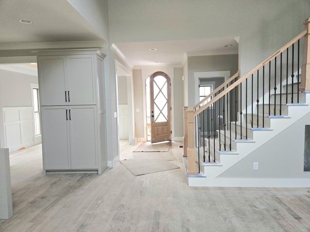 9892 Trestle Cir Unit 50, Ooltewah, TN 37363 - foyer entrance with light wood finished floors, ornamental molding, stairs, recessed lighting, and baseboards