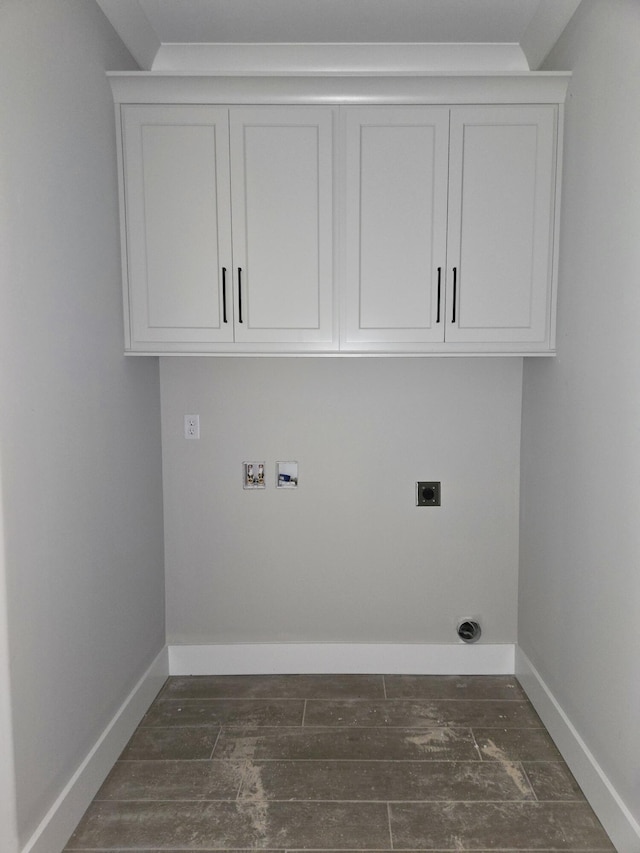 9892 Trestle Cir Unit 50, Ooltewah, TN 37363 - laundry area with electric dryer hookup, hookup for a washing machine, baseboards, dark wood finished floors, and cabinet space