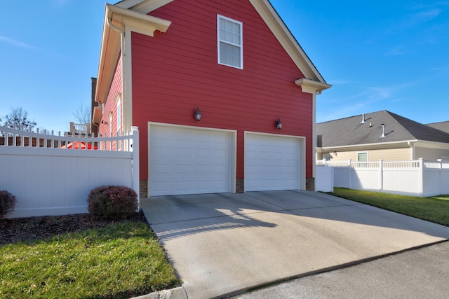 view of property exterior with a garage