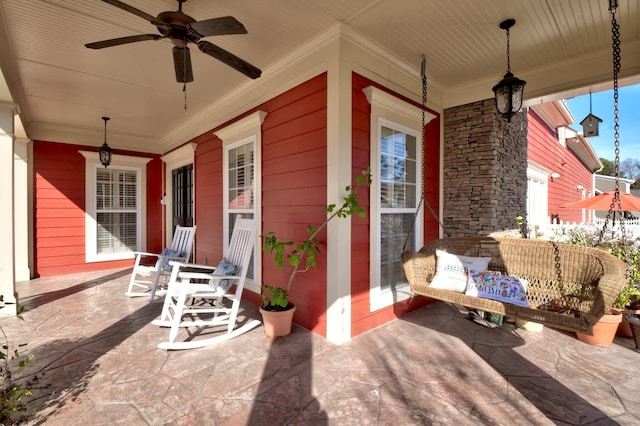 view of patio / terrace with ceiling fan and a porch