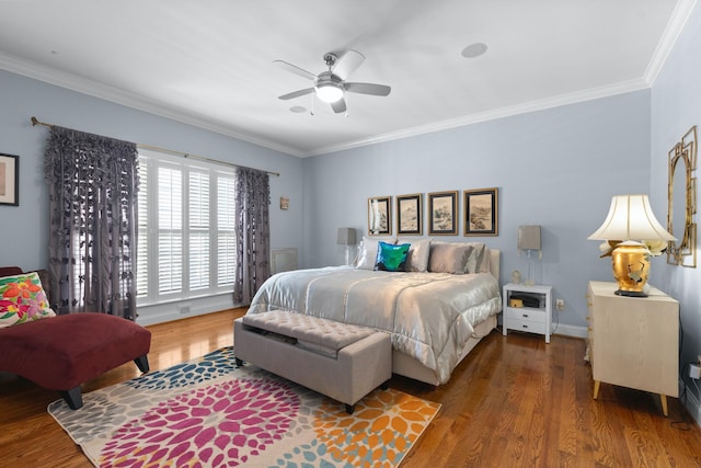 bedroom featuring ornamental molding, ceiling fan, and dark hardwood / wood-style flooring