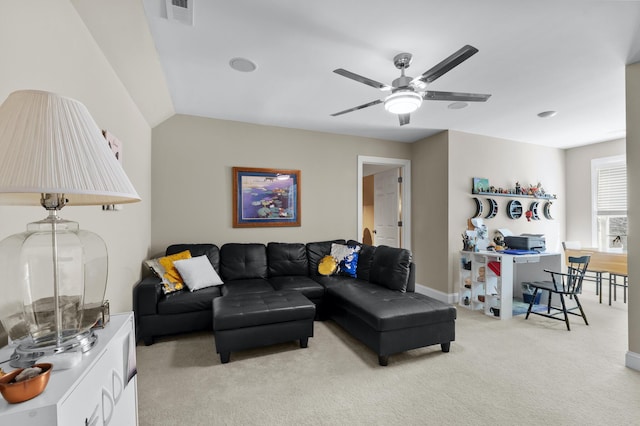 living room with light carpet and ceiling fan