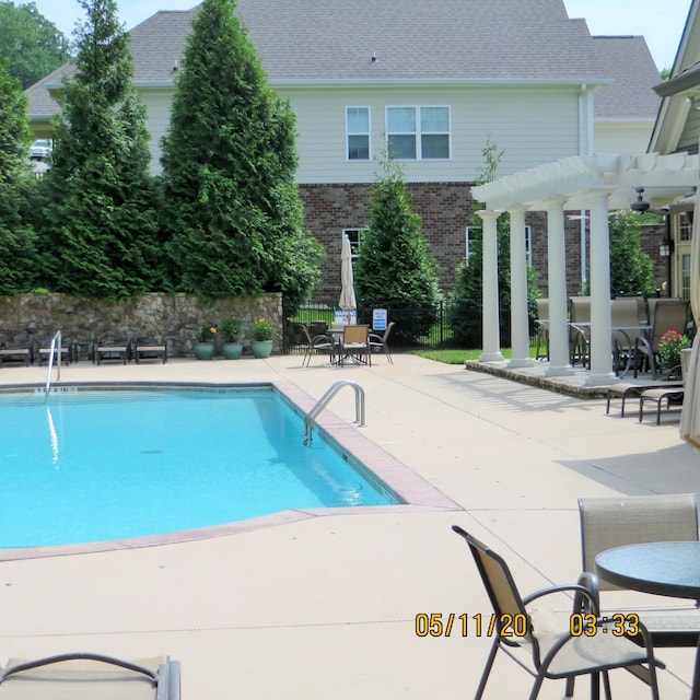 view of pool with a pergola and a patio area