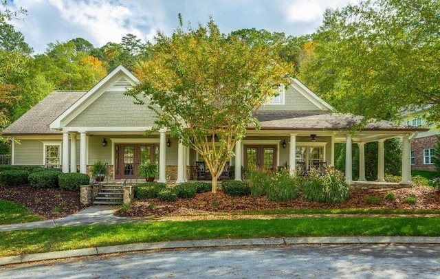 view of front of house with french doors and a porch