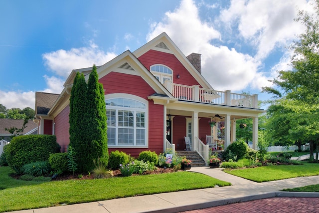 8625 Homecoming Dr, Chattanooga, TN 37421 - view of front of house featuring a porch, a balcony, ceiling fan, a front lawn, and a chimney