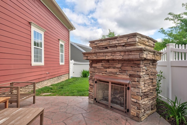 8625 Homecoming Dr, Chattanooga, TN 37421 - view of patio / terrace featuring a fireplace and fence