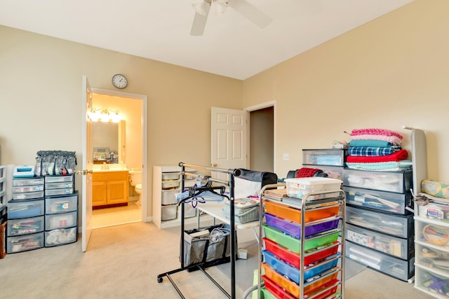 interior space featuring connected bathroom and ceiling fan