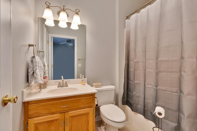 bathroom with vanity, toilet, and curtained shower