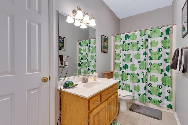 bathroom with vanity, tile patterned floors, toilet, and walk in shower