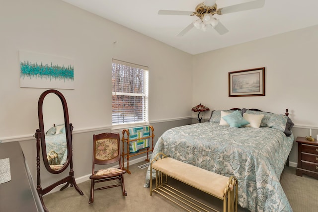 bedroom featuring ceiling fan and carpet