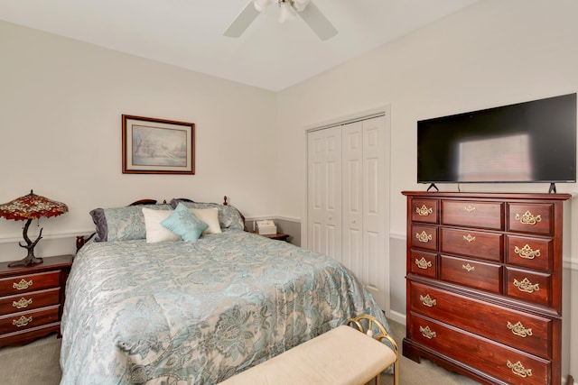 bedroom featuring light carpet, a closet, and ceiling fan