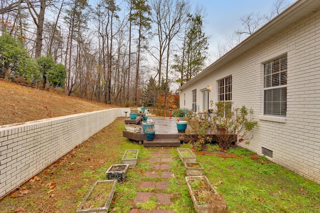 view of yard featuring a wooden deck