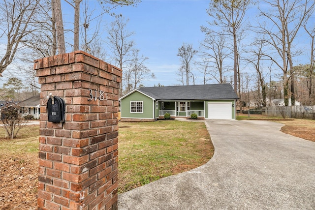 view of front of home with a porch, a garage, and a front yard