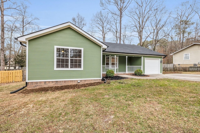 single story home featuring a garage, covered porch, and a front yard