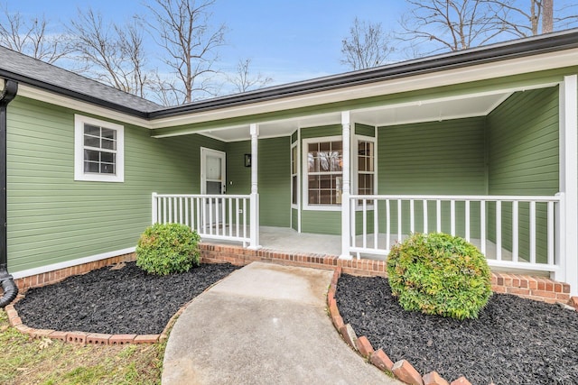 doorway to property featuring covered porch