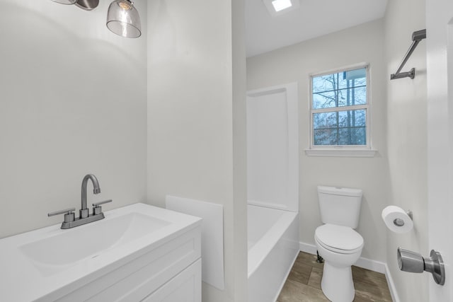 full bathroom featuring hardwood / wood-style flooring, vanity, shower / bath combination, and toilet