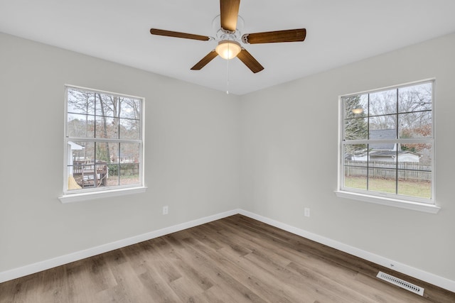 unfurnished room featuring ceiling fan and light hardwood / wood-style floors