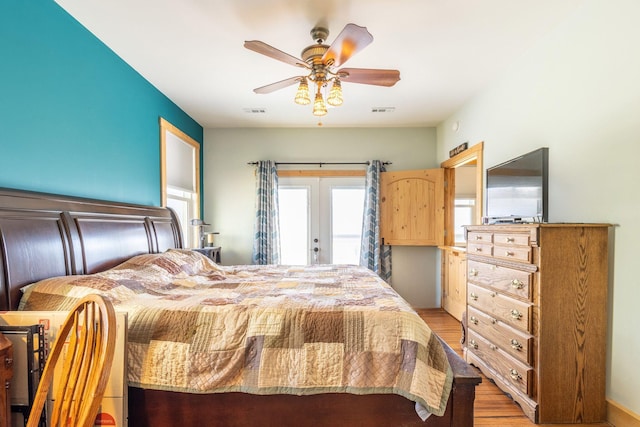 bedroom with french doors, ceiling fan, access to exterior, and light hardwood / wood-style flooring