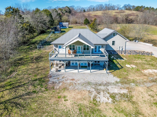 rear view of property featuring a patio