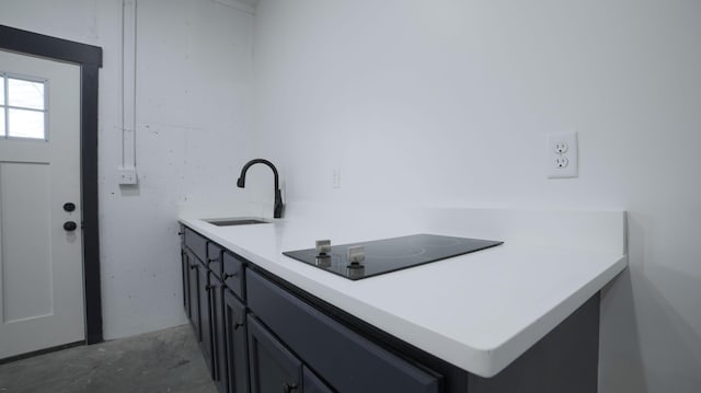 interior space featuring concrete flooring and sink