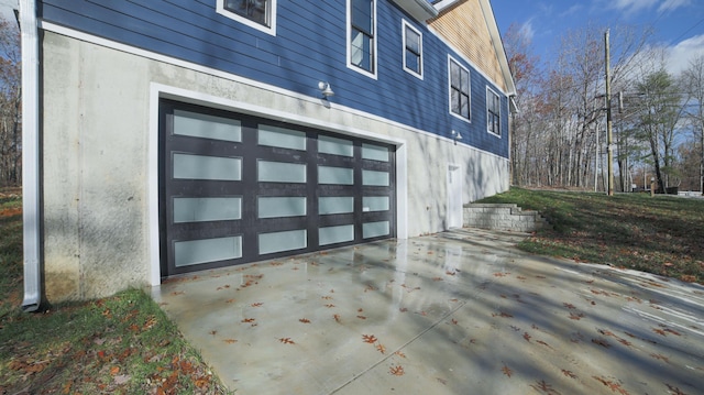 view of property exterior with a garage