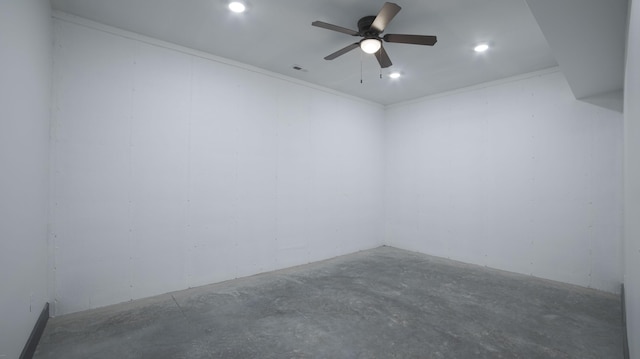 unfurnished room with crown molding, ceiling fan, and concrete flooring