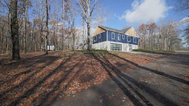 view of side of property with a garage