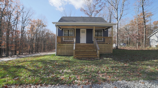 bungalow with covered porch and a front lawn