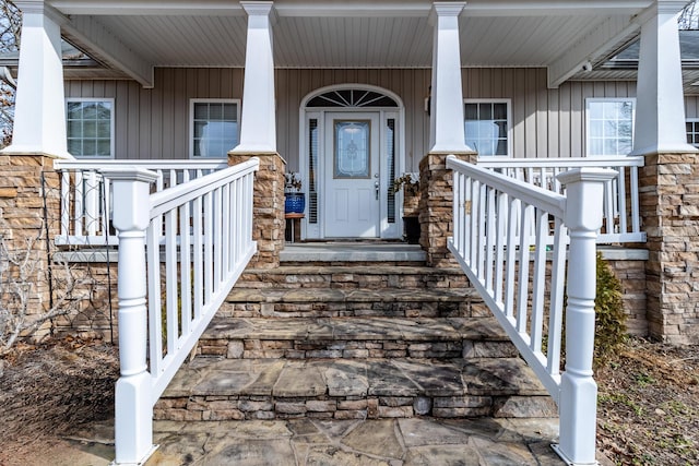 doorway to property featuring covered porch