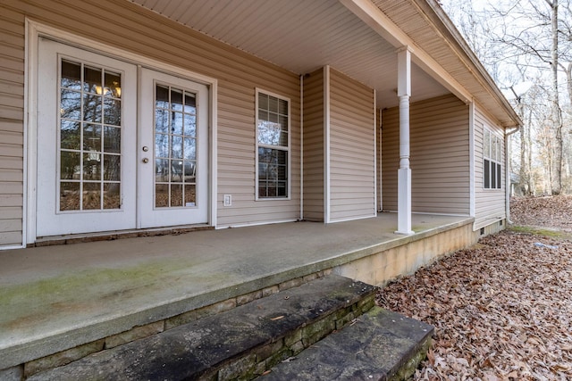 entrance to property with french doors and a patio area