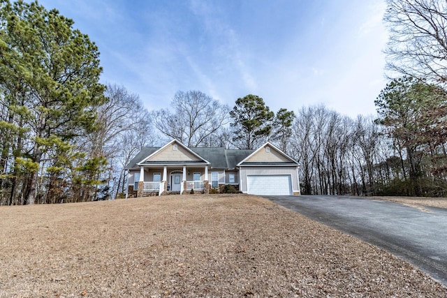 view of front of house with a garage and covered porch