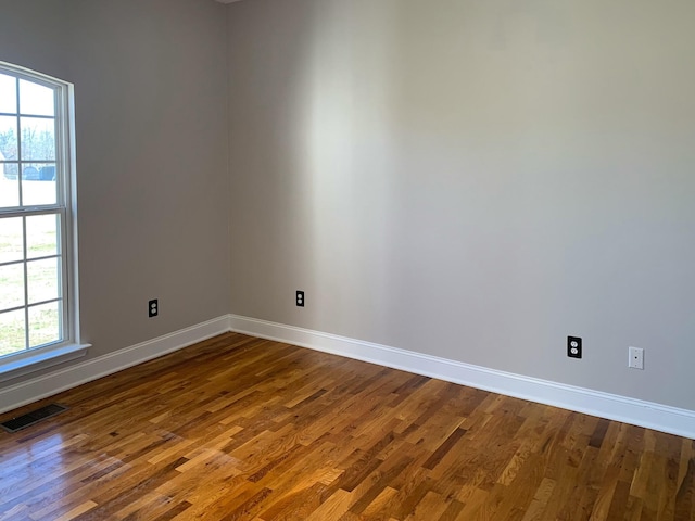 unfurnished room featuring hardwood / wood-style floors