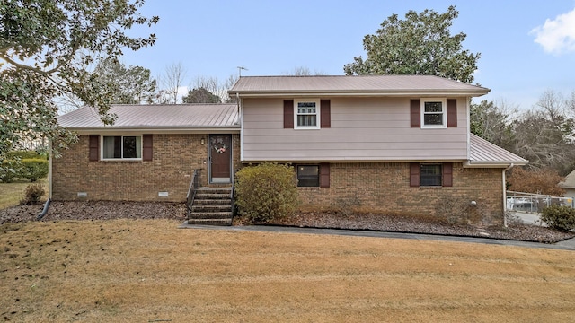 split level home with a front yard