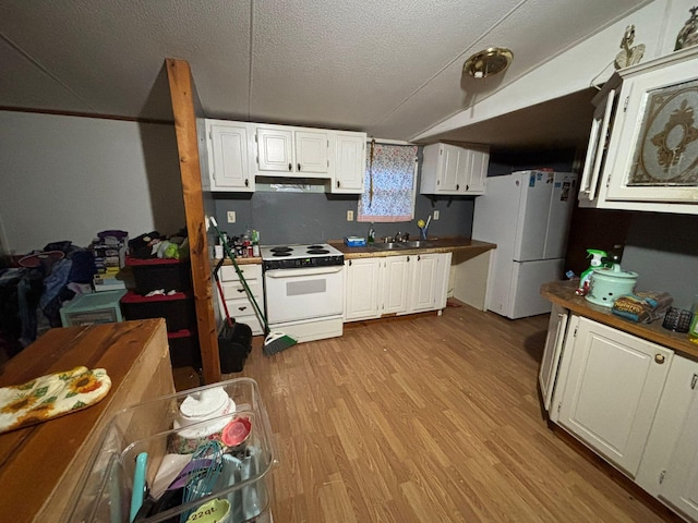 kitchen featuring sink, a textured ceiling, white appliances, light hardwood / wood-style floors, and white cabinets