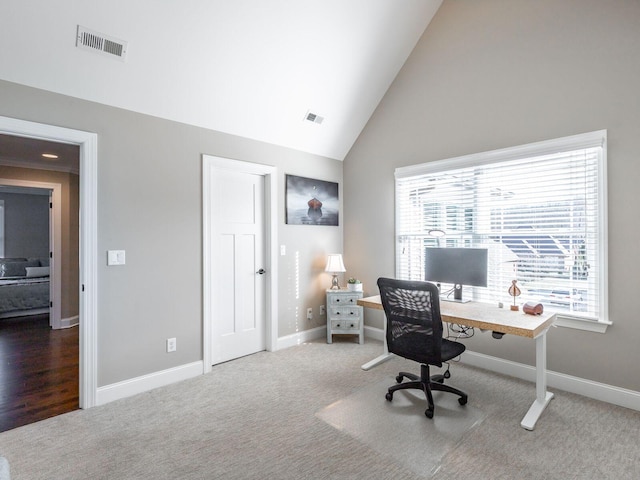 carpeted office with high vaulted ceiling