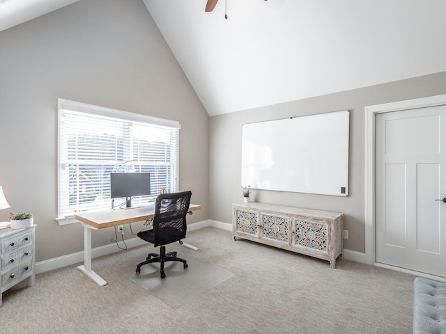 carpeted home office featuring vaulted ceiling and ceiling fan