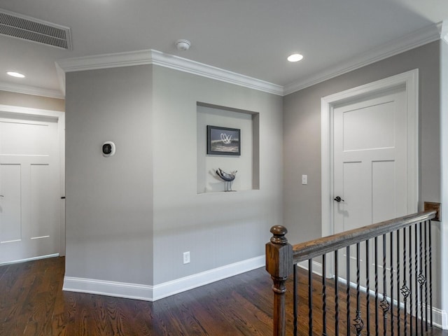 hall featuring dark hardwood / wood-style flooring and ornamental molding