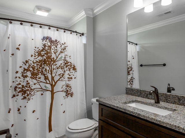 bathroom with ornamental molding, toilet, and vanity