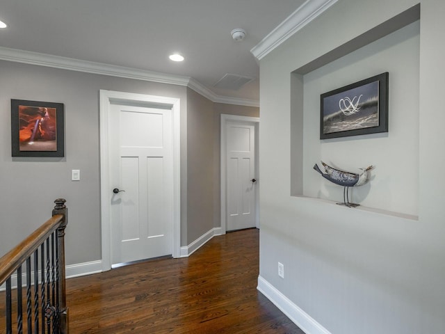 hall featuring dark wood-type flooring and ornamental molding