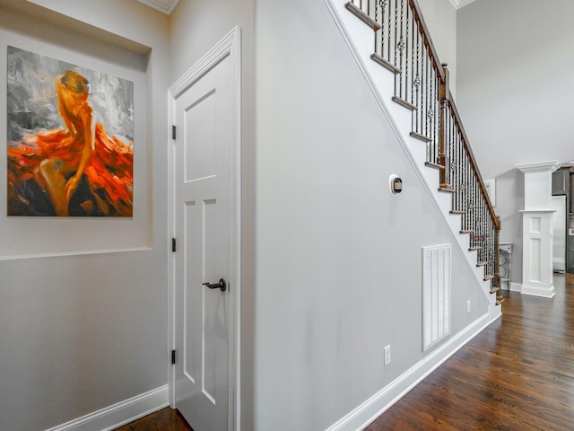 hallway with dark hardwood / wood-style floors