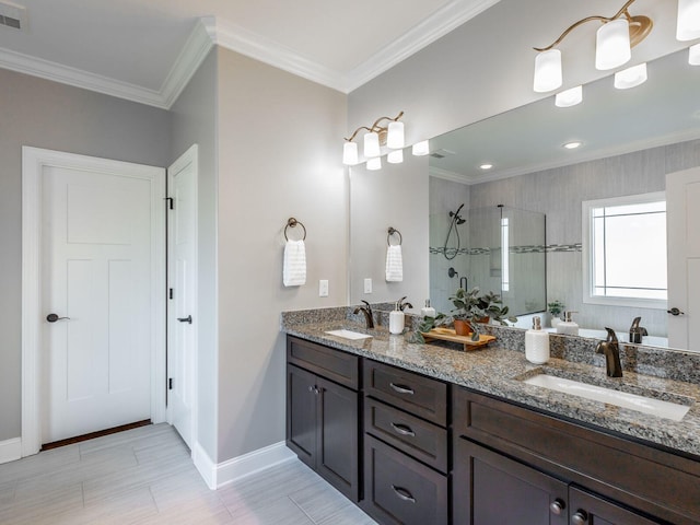 bathroom with a tile shower, vanity, and ornamental molding