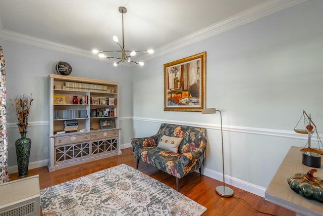 living area featuring a notable chandelier, crown molding, and wood-type flooring