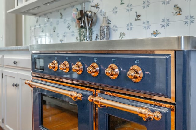 details with white cabinetry and stove