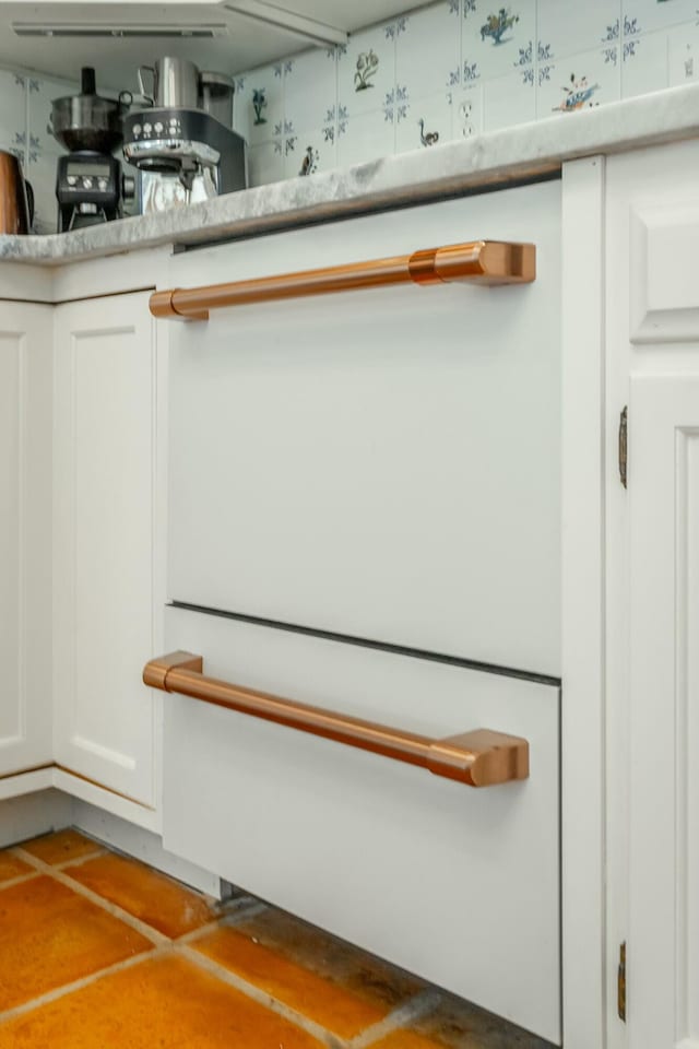 interior details featuring white cabinetry