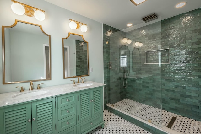 bathroom with vanity, an enclosed shower, and tile patterned flooring