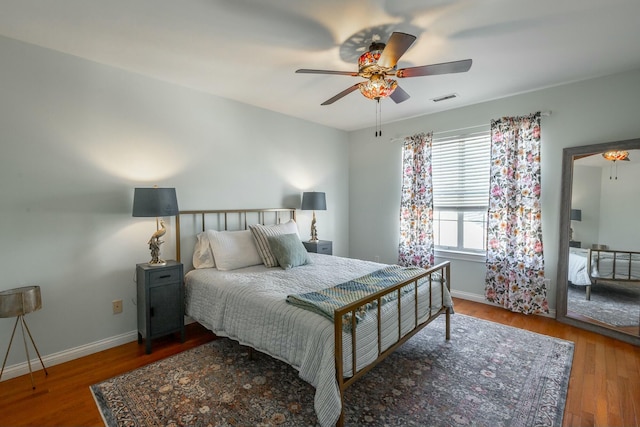 bedroom featuring hardwood / wood-style flooring and ceiling fan