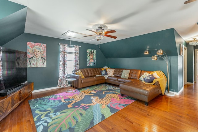 living room featuring lofted ceiling, hardwood / wood-style floors, and ceiling fan