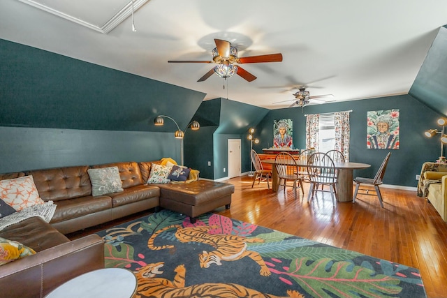 living room with lofted ceiling, hardwood / wood-style floors, and ceiling fan