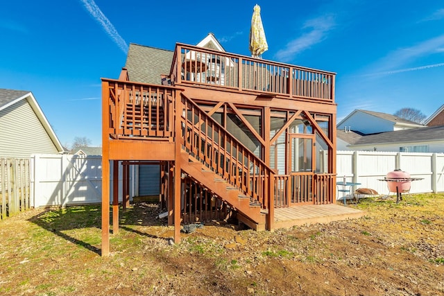 back of house with a wooden deck